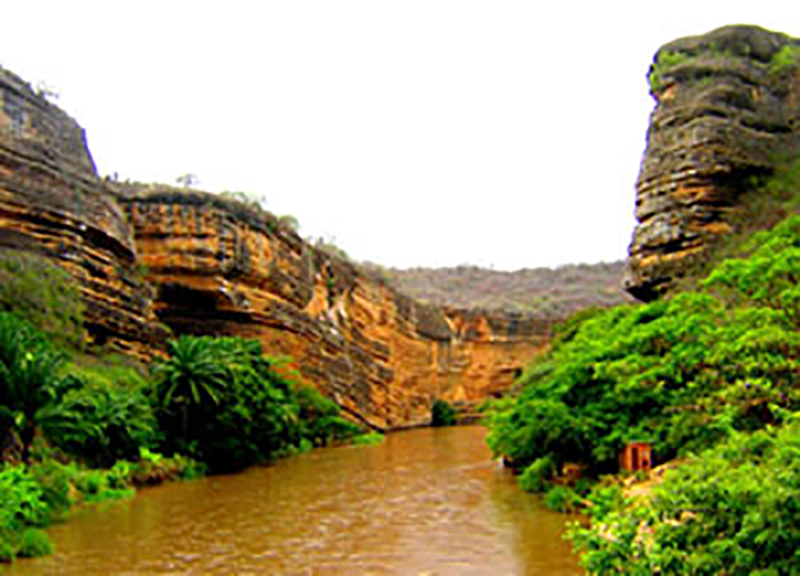 Cubal River gorge, south of Sumbe, Angola exposing Upper Cretaceous carbonates of the Kwanza Basin. These carbonates correlate to the Pinda Formation limestones and dolomites which have produced over 1.5 billion barrels of oil in shoal deposits in the shallow water areas of the Lower Congo Basin. Photo courtesy of Tako Koning
